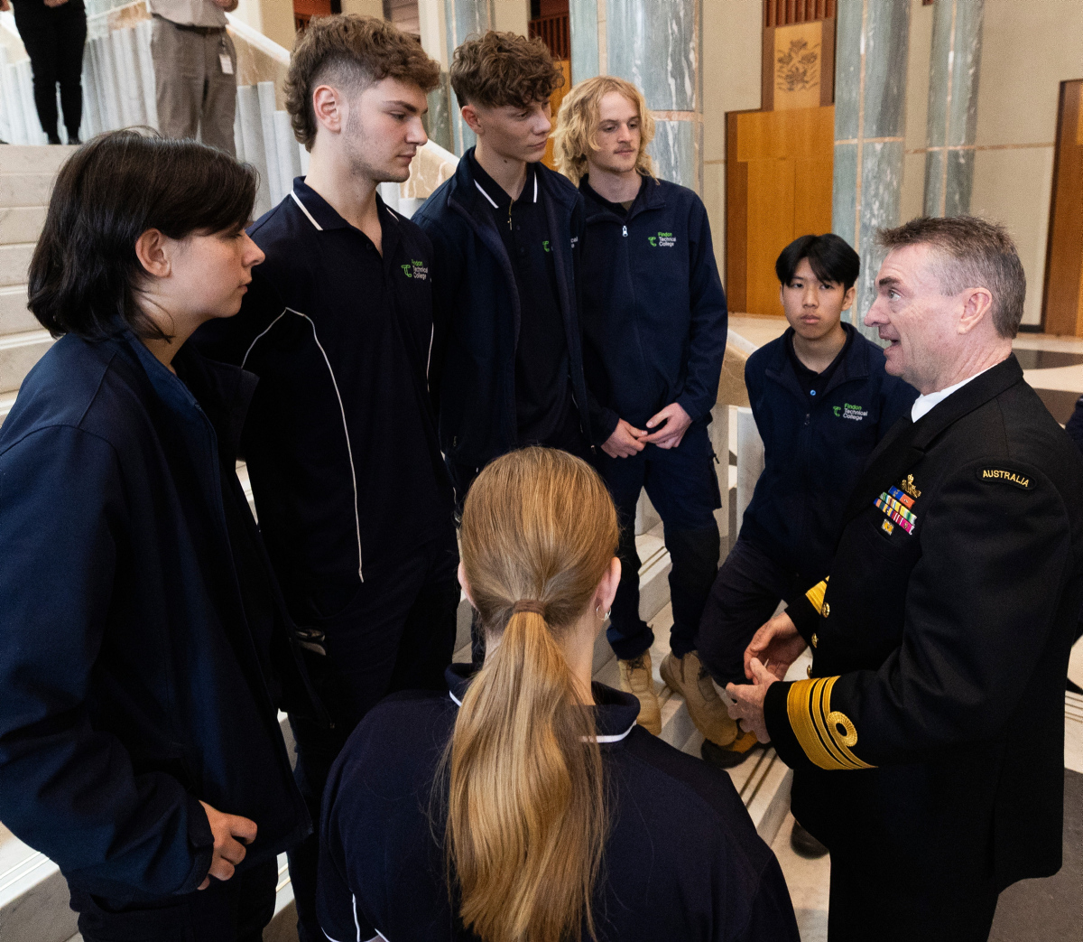 Australian Submarine Agency Director-General, Vice Admiral Jonathan Mead (right), speaking with students from a technical college at Parliament House in Canberra following the Defending Australian panel discussion. Image: Department of Defence
