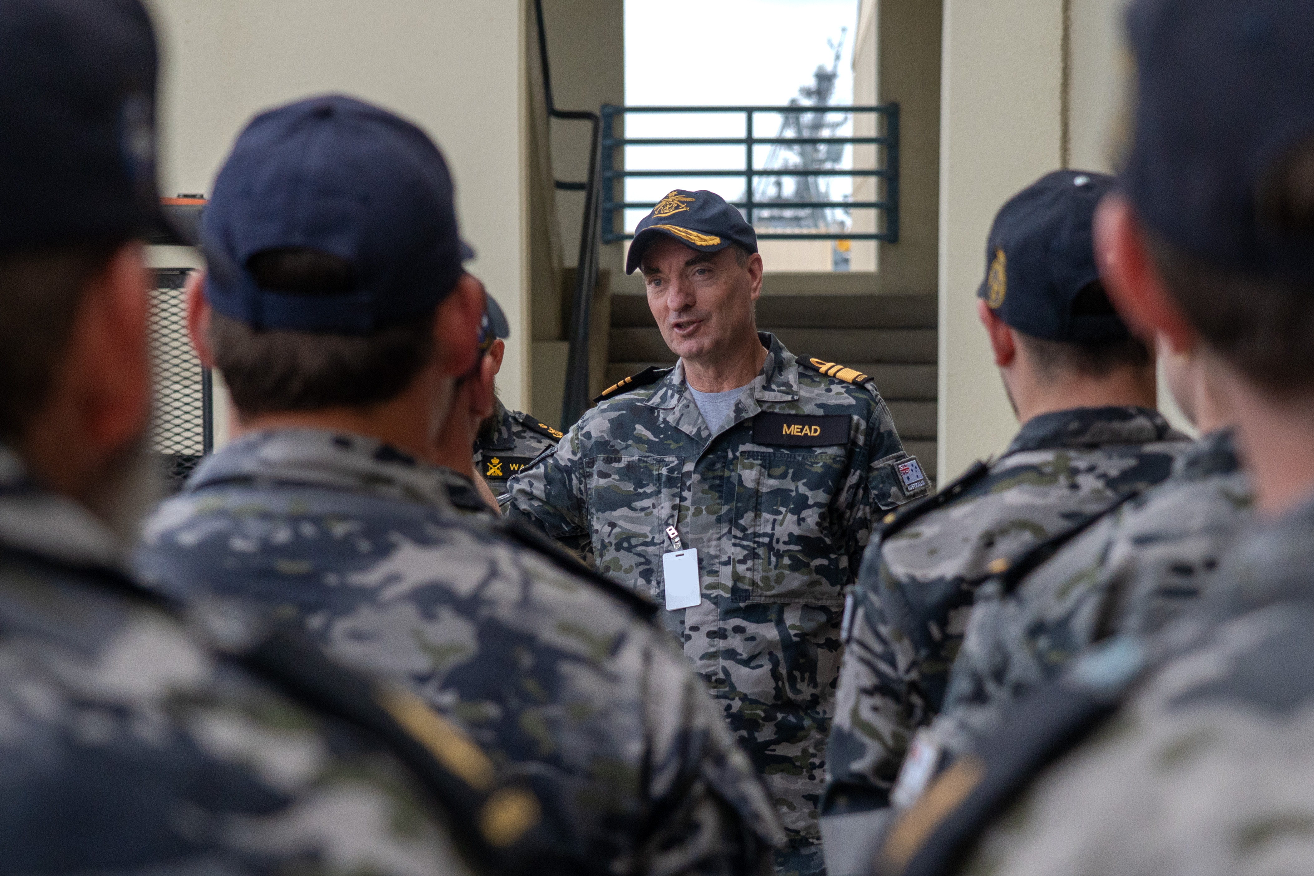 Royal Australian Navy VADM Jonathan Mead, Director-General of the Australian Submarine Agency, speaks with Australian sailors assigned to Pearl Harbor Naval Shipyard & Intermediate Maintenance Facility during a visit to the shipyard.