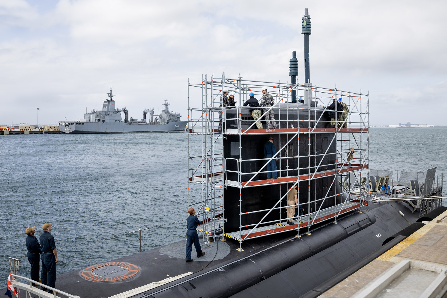 Royal Australian Navy and US Navy personnel conduct routine maintenance aboard the USS Hawaii (SSN 776) at HMAS Stirling.