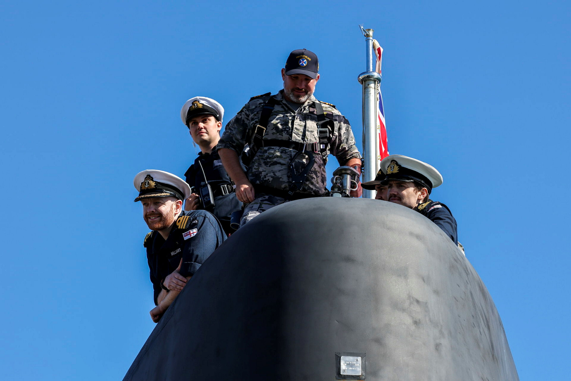 HMS Anson's crew along with Australian counterpart, seen here as the boat arrives into Australia.