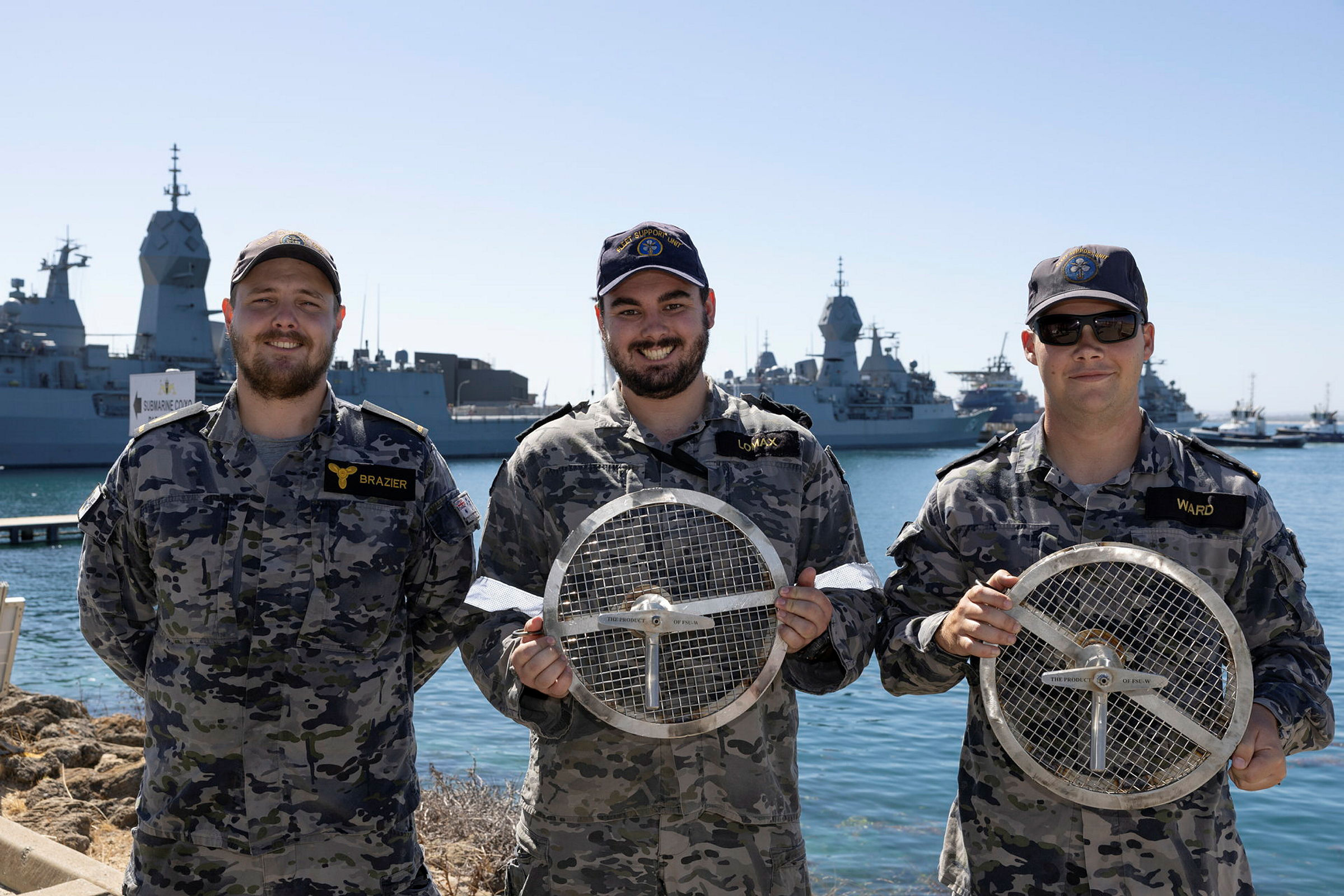 (l-r) Able Seaman Adam Brazier, Leading Seaman Sam Lomax, and Seaman Patrick Ward of the Fleet Support Unit - West hold the Australian Made Seawater strainers at HMAS Stirling before they are installed onto HMS Anson.
