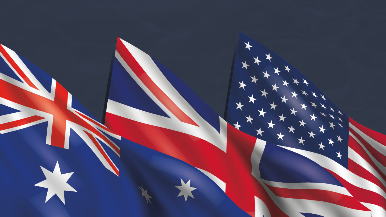 Australian, UK and US flags overlap and wave together against a dark blue background.