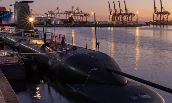 Image of submarine docked in a bay