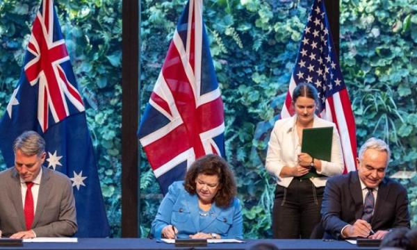 The Deputy Prime Minister and Minister for Defence, the Hon Richard Marles MP, US Deputy Secretary of State, Kurt Campbell, and British Ambassador to the USA, Dame Karen Pierce, sign the AUKUS Agreement for Cooperation Related to Naval Nuclear Propulsion in Washington DC, 5 August 2024.