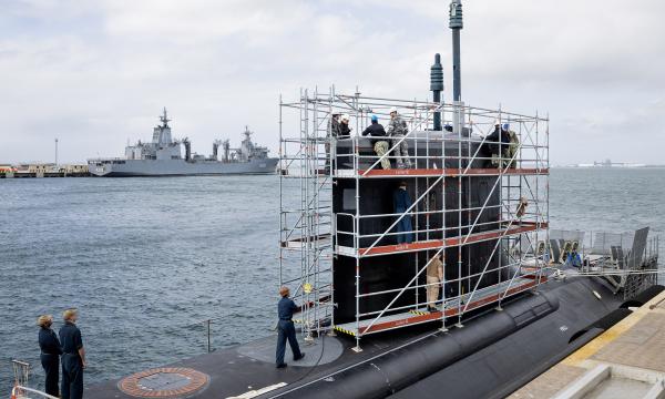 Royal Australian Navy and US Navy personnel conduct routine maintenance aboard the USS Hawaii (SSN 776) at HMAS Stirling.